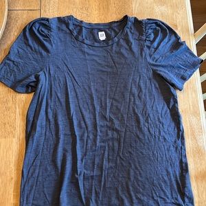 Blue tshirt with a slight puffy sleeve.